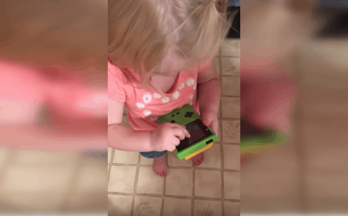 little girl gameboy swiping